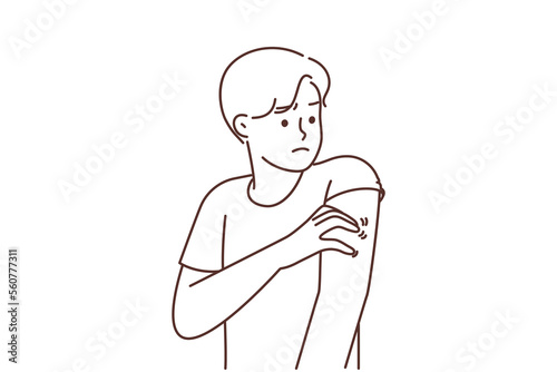 Unhealthy man scratching arm suffer from pox