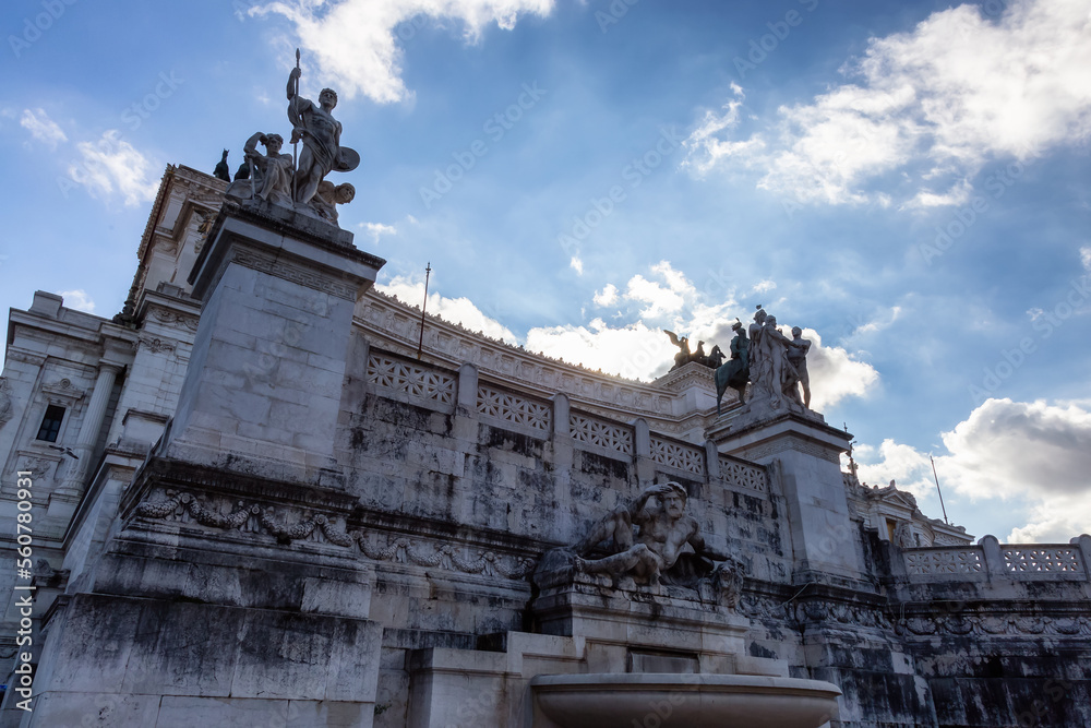 Historical Sculptures in the city of Rome, Italy. Altar of the Fatherland. Sunny and cloudy sky.