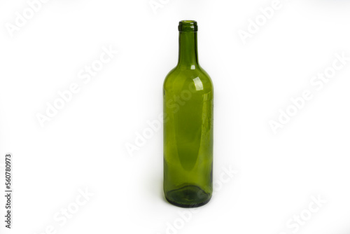 Empty wine green glass bottle on a white background