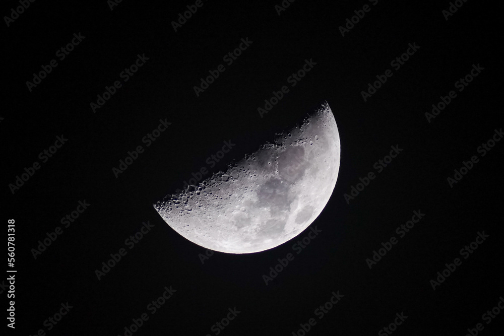 First Quarter Moon phase at 3 September 2022 zoom in close up detail trough telescope rising time-lapse evolution. Half lit First Quarter Moon phase at 3 September 2022 zoom in close up detail trough telescope rising time-lapse evolution. Half lit