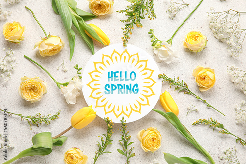 Composition of card with text HELLO SPRING and beautiful flowers on light background