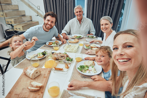 Family, selfie and dinner with generations and food, parents with grandparents and children smile for picture with quality time together. Photo, big family and happiness with nutrition and meal. photo