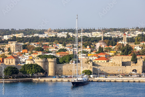 Sailboat near Historic Old Town in City on the Mediterranean Sea, Rhodes, Greece.