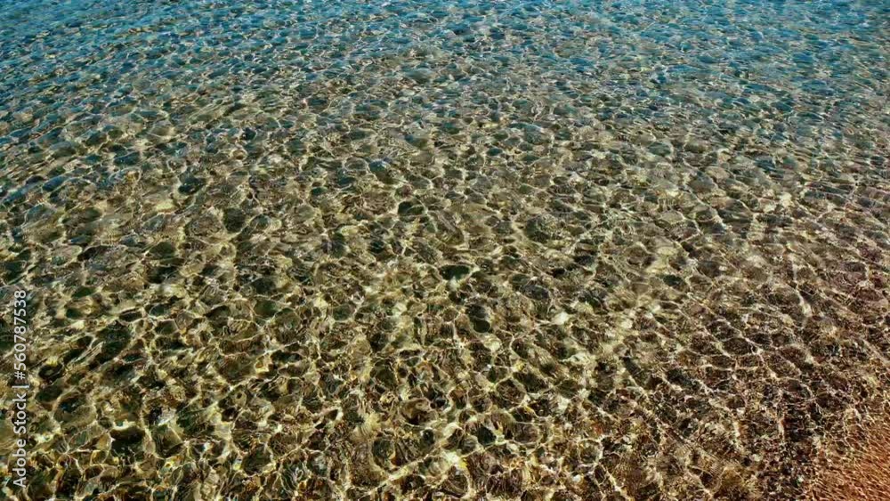 Reflection of Golden sunlight over sea surface texture background,the sun rises right above the sea beautiful ray is reflected on the sea surface of the water. Water is filled with golden light Reflection of Golden sunlight over sea surface texture background,the sun rises right above the sea beautiful ray is reflected on the sea surface of the water. Water is filled with golden light