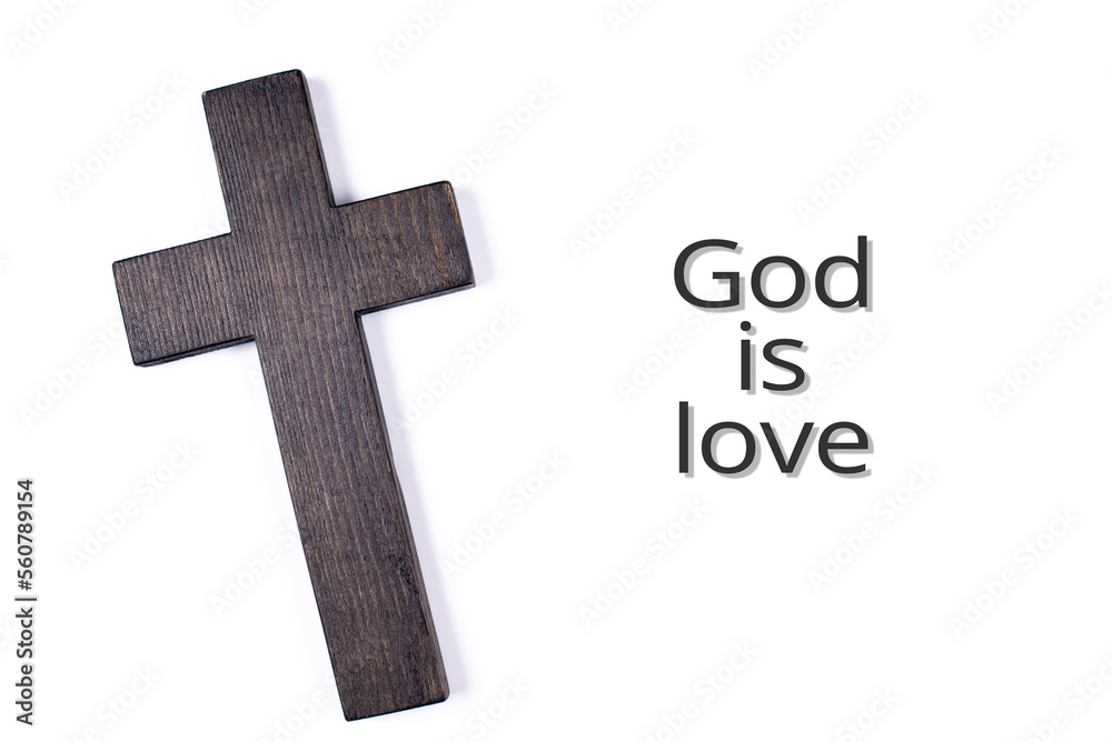 The cross of Jesus is wooden. Crucifixion on a white background. God is love. The heart symbolizes eternal life given by God.