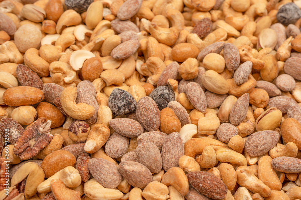 A group of almonds, pistachios, walnuts, macadamia, cashews. A group of almonds, pistachios, walnuts, macadamia, cashews.