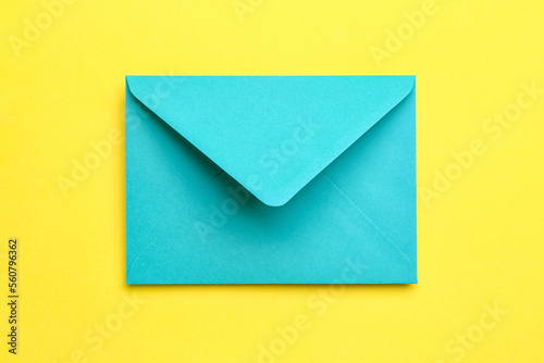 Paper envelope on yellow background