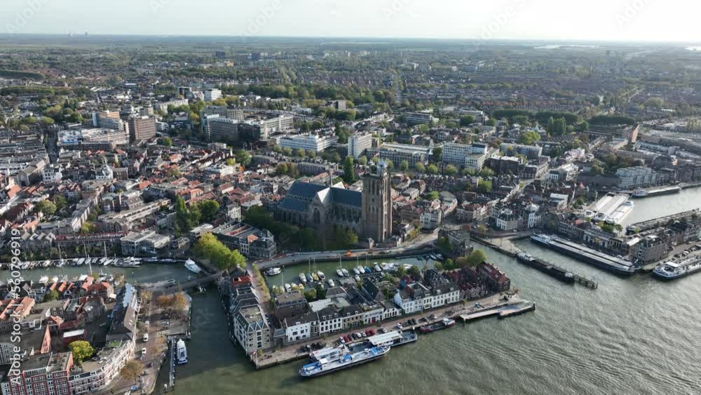 Aerial of city Dordrecht in Zuid Holland, in The Netherlands, europe. City along the water, old historic center, buildings, port and main church of the city. Skyline.