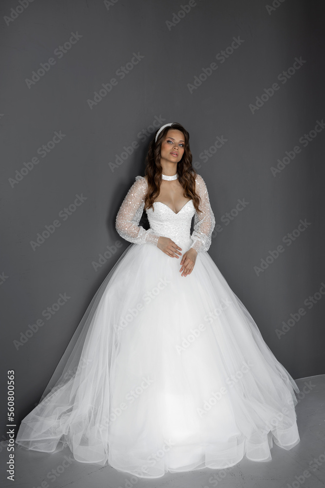 stylish caucasian bride in white wedding dress	