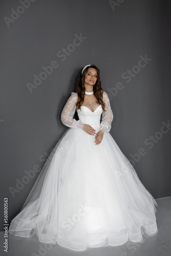 stylish caucasian bride in white wedding dress 