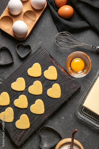 Wooden board with raw heart...