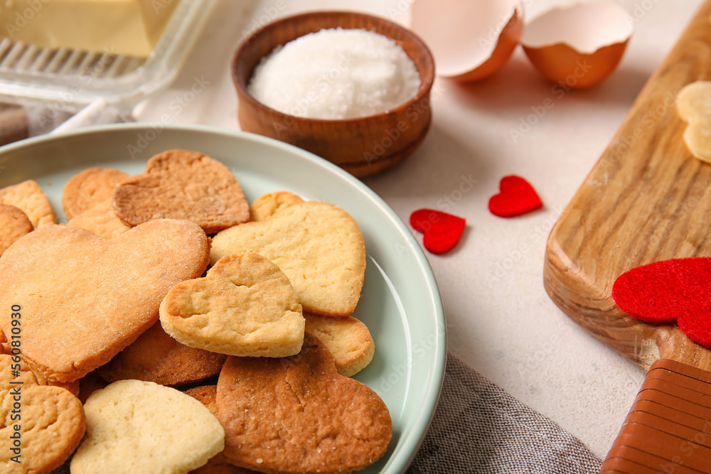 Plate with sweet heart shaped cookies on table, closeup. Valentines Day celebration Plate with sweet heart shaped cookies on table, closeup. Valentines Day celebration