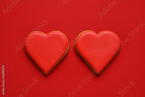 Sweet heart shaped cookies on red background. Valentines Day celebration
