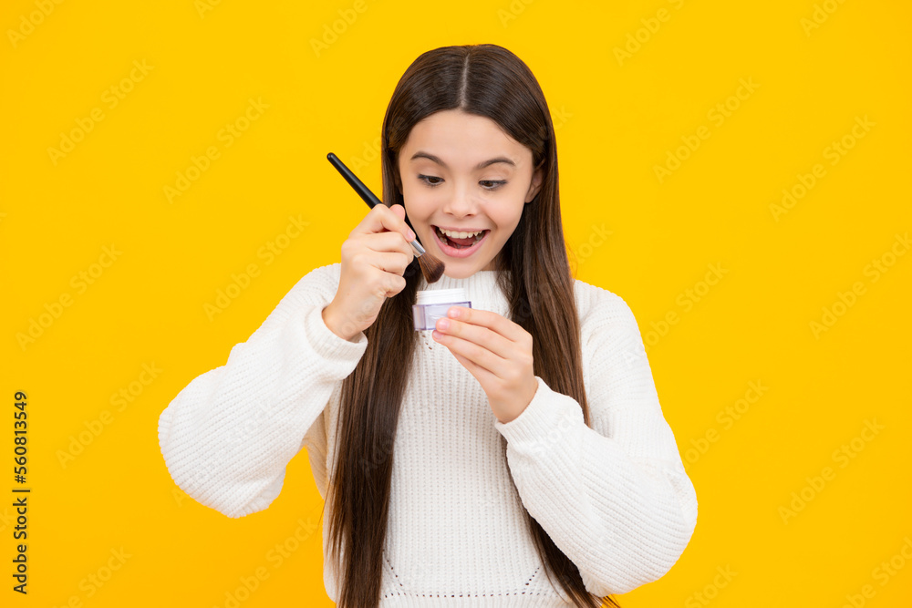 Beautiful portrait of teen girl child artist apply powder with make up brush. Makeup products. Beauty, and cosmetics for teenagers. Beautiful portrait of teen girl child artist apply powder with make up brush. Makeup products. Beauty, and cosmetics for teenagers.
