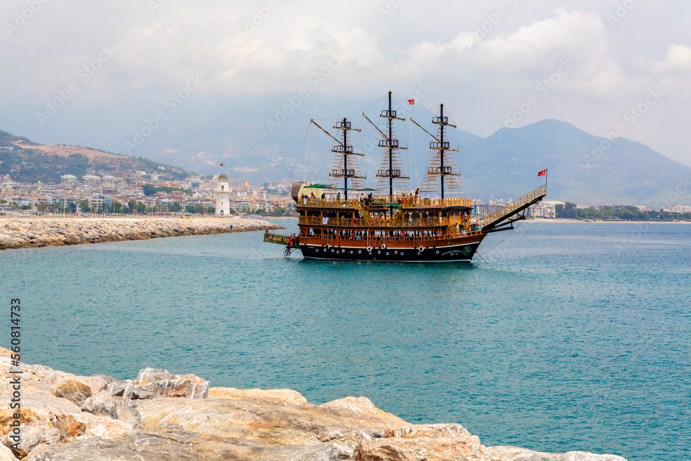 Alanya, Turkey - Aug 08, 2022. Pirate ship in Alanya harbour. Animation tourist ship cruising around Alanya Castle Alanya, Turkey - Aug 08, 2022. Pirate ship in Alanya harbour. Animation tourist ship cruising around Alanya Castle