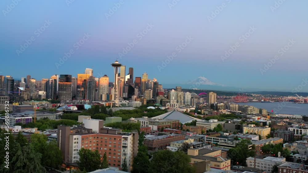 Aerial Forward Shot Of Space Needle Amidst Houses And Buildings In City During Sunset - Seattle, Washington Aerial Forward Shot Of Space Needle Amidst Houses And Buildings In City During Sunset - Seattle, Washington