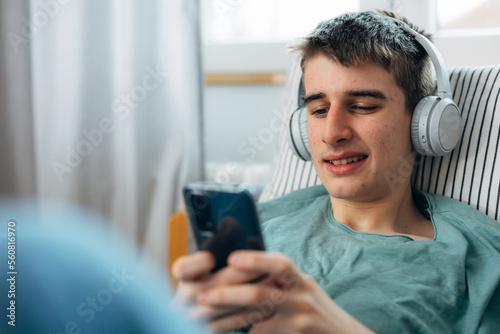 Close up view of a teenage boy using his pone