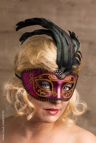 blonde woman portait with venetian mask