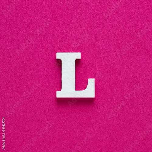 Alphabet letter L - White wooden letter on rhodamine red background