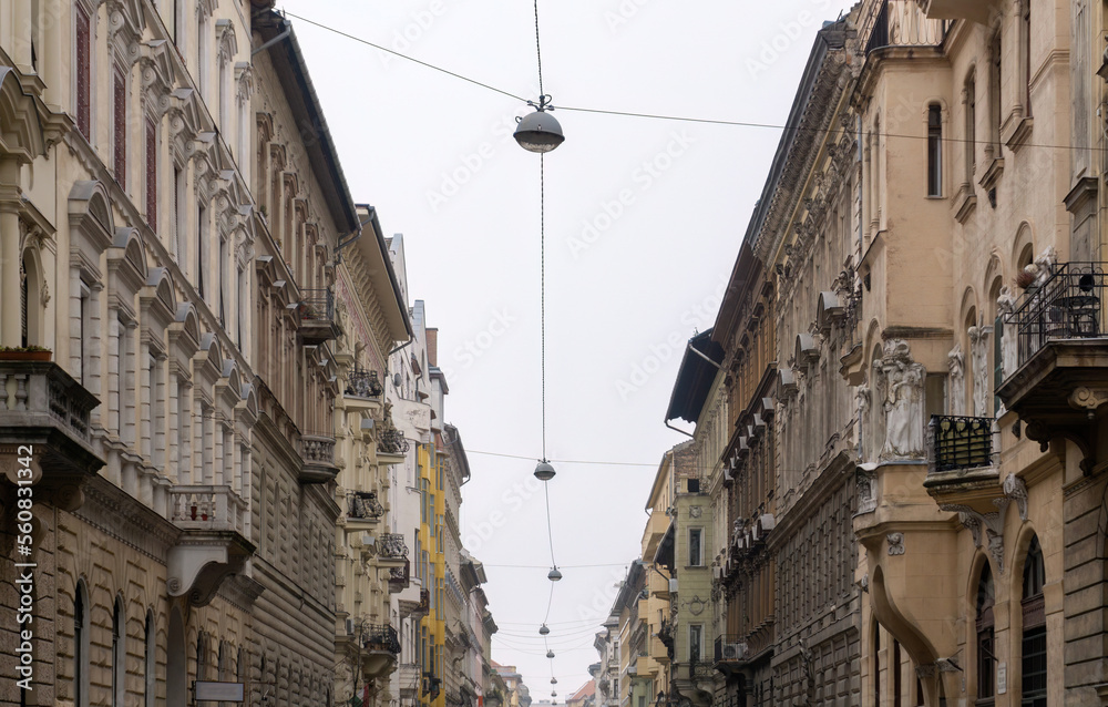 Lanterns over a street in the old center of Budapest
