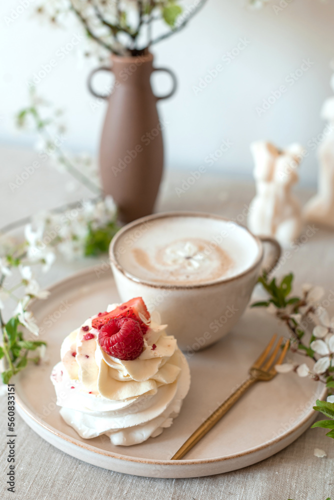 Cup with cappuccino and cake, spring flowers, morning concept, linen tablecloth, candles, woman's day Cup with cappuccino and cake, spring flowers, morning concept, linen tablecloth, candles, woman's day