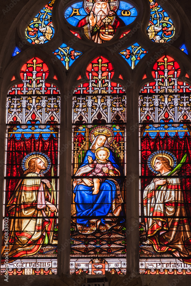 Saint Gervais, Saint Protais, the Virgin Mary and baby Jesus Christ on a stained glass window in the Cathedral of Lectoure, south of France (Gers)
