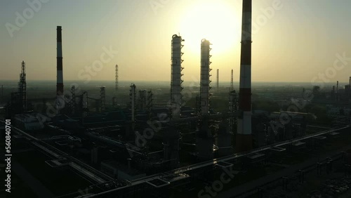 Oil Refinery. A column in rays of sun. Aerial view