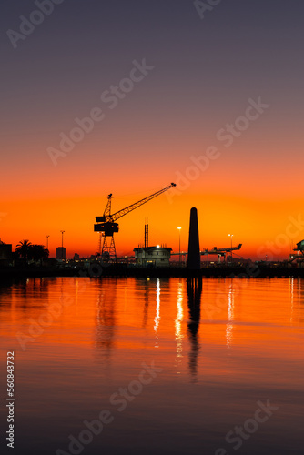 Silhouette of crane at Port Melbourne during sunrise time.