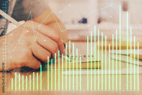 Multi exposure closeup hands with stock market forex graph. © peshkova