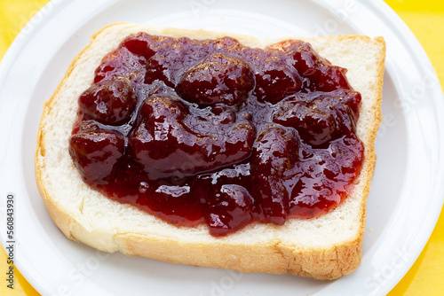 Sliced bread with strawberry jam