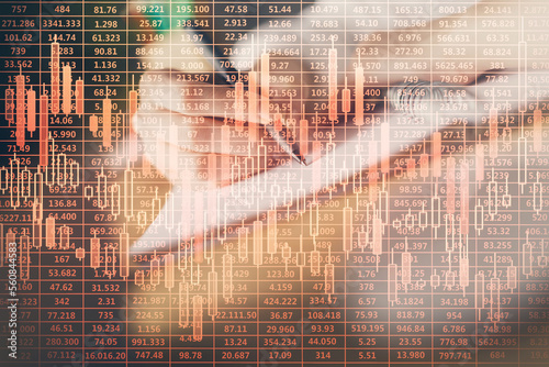 Financial forex graph displayed on hands taking notes background. Concept of research. Double exposure © peshkova