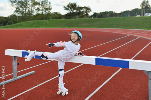 A girl in vintage white roller skates and a helmet at the stadium © o1559kip