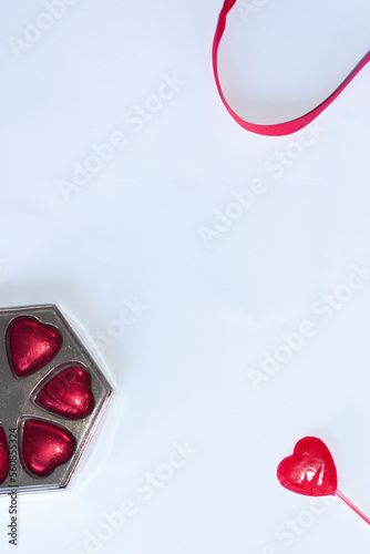 valentines day background with gifts, hearts and red ribbons decorating
white background with place for text design