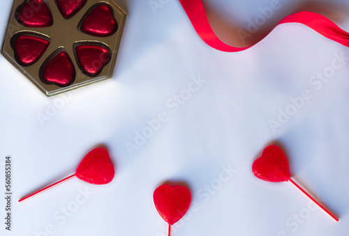 valentines day background with gifts, hearts and red ribbons decorating
white background with place for text design