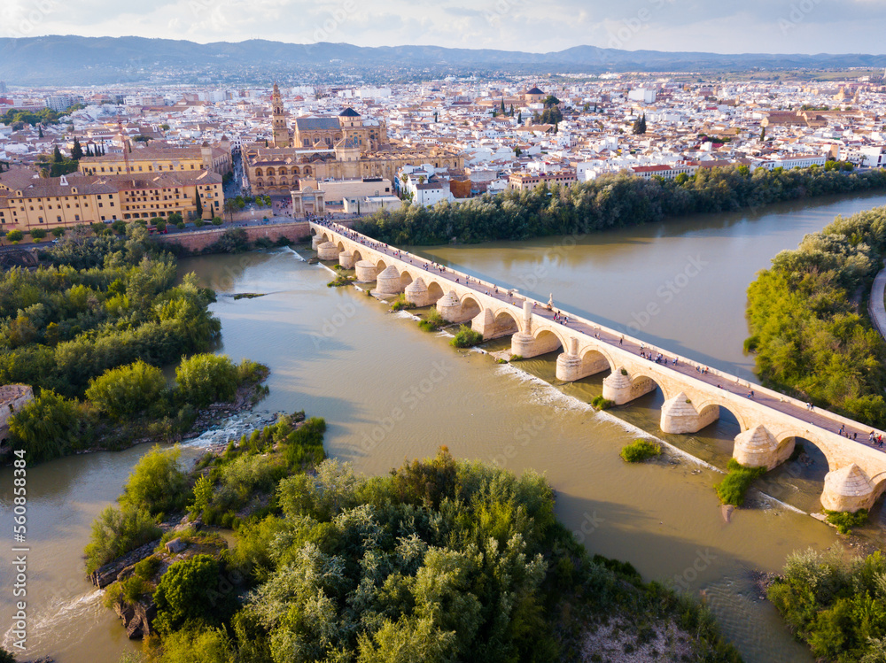 Aerial panoramic view of Mosque-Cathedral of Cordoba and Roman Bridge over the Guadalquivir