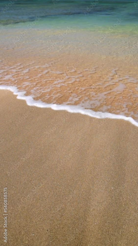 Lockdown Shot Of Waves Rushing On Sand At Beach During Sunny Day - Oahu, Hawaii Lockdown Shot Of Waves Rushing On Sand At Beach During Sunny Day - Oahu, Hawaii