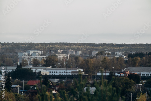 View of a small town, surrounded by forest and nature. City landscape. © Алексей Орлов