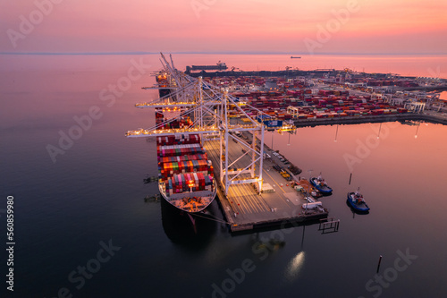 Cargo terminal loading shipping containers onto cargo ships, aerial footage, hyperlapse, Vancouver, BC, Canada, marine terminal, cargo crane. photo