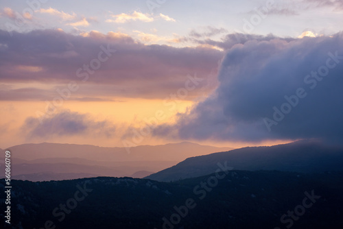 Sunset over the mountains in corfu, Greece © ernestos