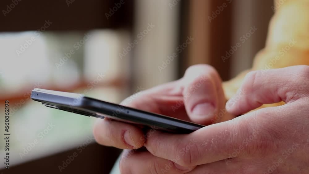 a man uses a cell phone to record and send a close-up message. Hold a mobile phone in your hand. The concept of 5g mobile technology and the display of people exchanging and reading Sms messages. a man uses a cell phone to record and send a close-up message. Hold a mobile phone in your hand. The concept of 5g mobile technology and the display of people exchanging and reading Sms messages.