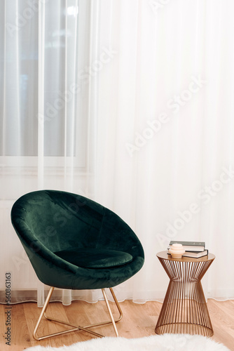 Stylish sofa, details of lounge chair. Boho design, comfortable area with textures and modern furniture