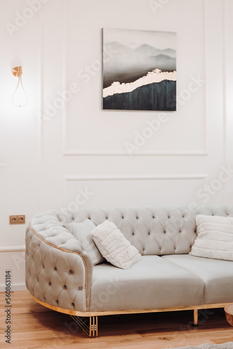 Stylish sofa, details of couch fabric and pillows. Boho design, comfortable sofa with textures and modern furniture