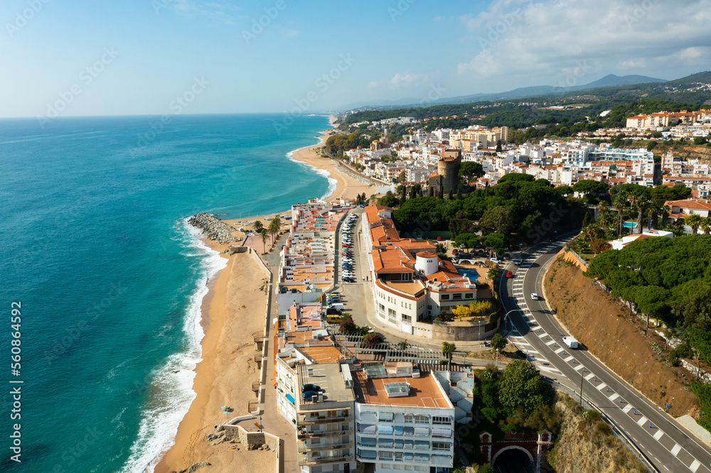 Aerial photo of Spanish municipality Sant Pol de Mar with view of beach and residential buildings.