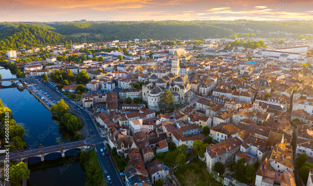 Picturesque aerial view of summer cityscape of Perigueux overlooking medieval Cathedral of Saint Front in rays of setting sun, France..