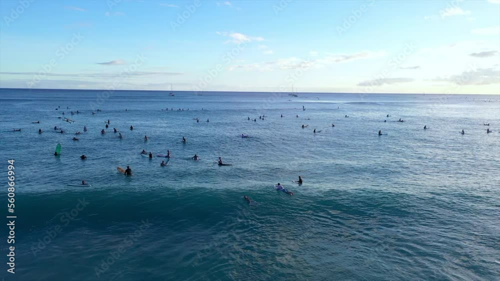 Aerial Panning Shot Of People With Surfboard In Blue Sea During Vacation - Oahu, Hawaii Aerial Panning Shot Of People With Surfboard In Blue Sea During Vacation - Oahu, Hawaii