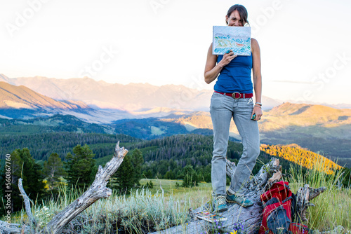 Woman shows off her mountain drawing photo