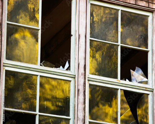 Reflections in broken windows at Lairds Landing, Tomales Bay, Point Reyes National Seashore, CA. photo