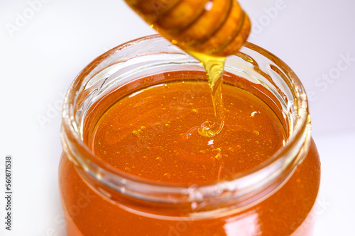 Fresh honey on clean background