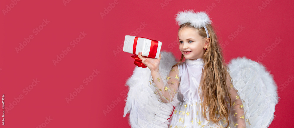 Valentines day banner with angel child. Angel children girl with white wings. Angel kids with present gift, studio portrait. Horizontal photo banner for website header design Valentines day banner with angel child. Angel children girl with white wings. Angel kids with present gift, studio portrait. Horizontal photo banner for website header design