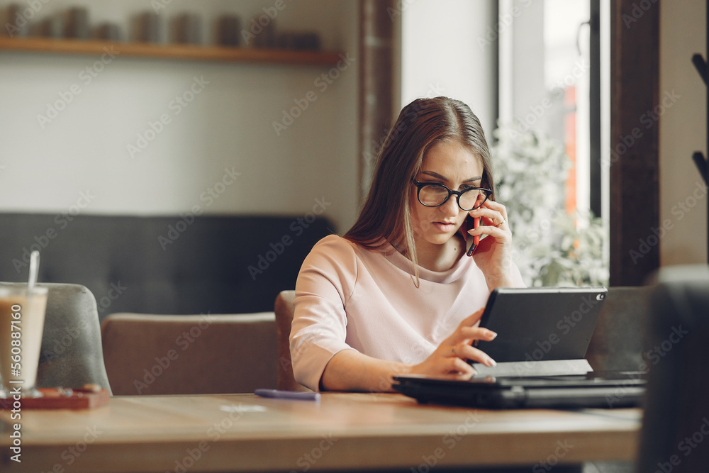 Businesswoman working in a cafe Businesswoman working in a cafe